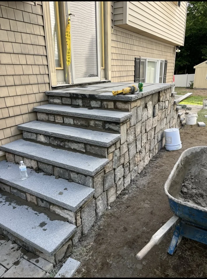 Stone stair build with granite treads